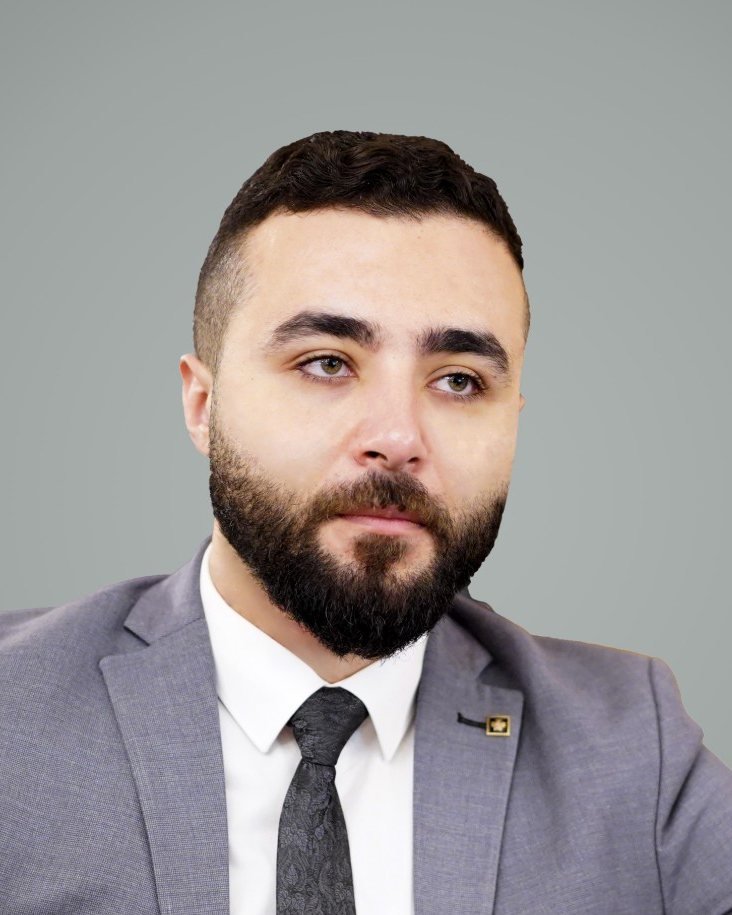 Mohamed Abdelsalam in a grey suit during a project meeting